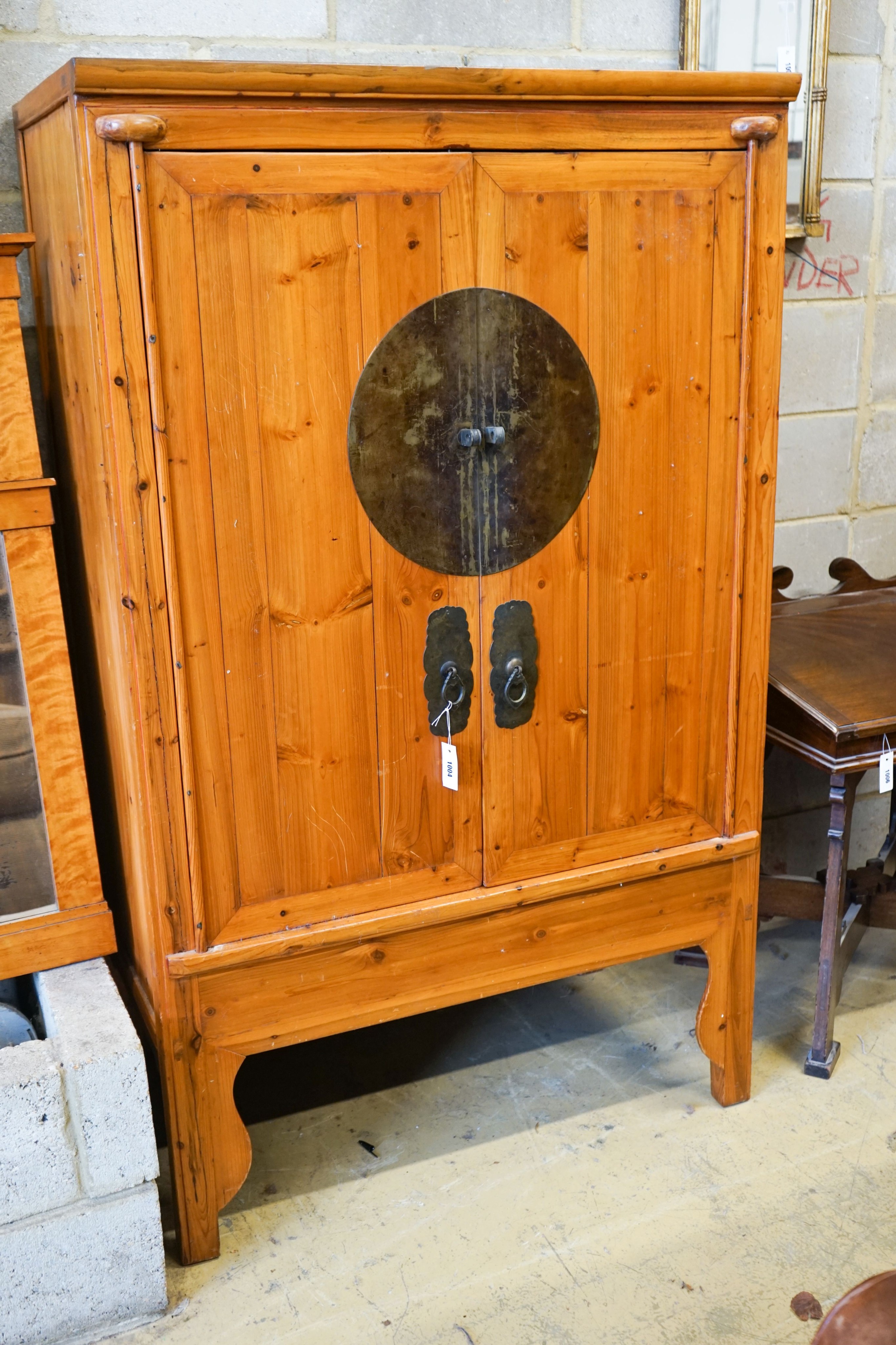 A Chinese pine cabinet, width 104cm, depth 61cm, height 173cm